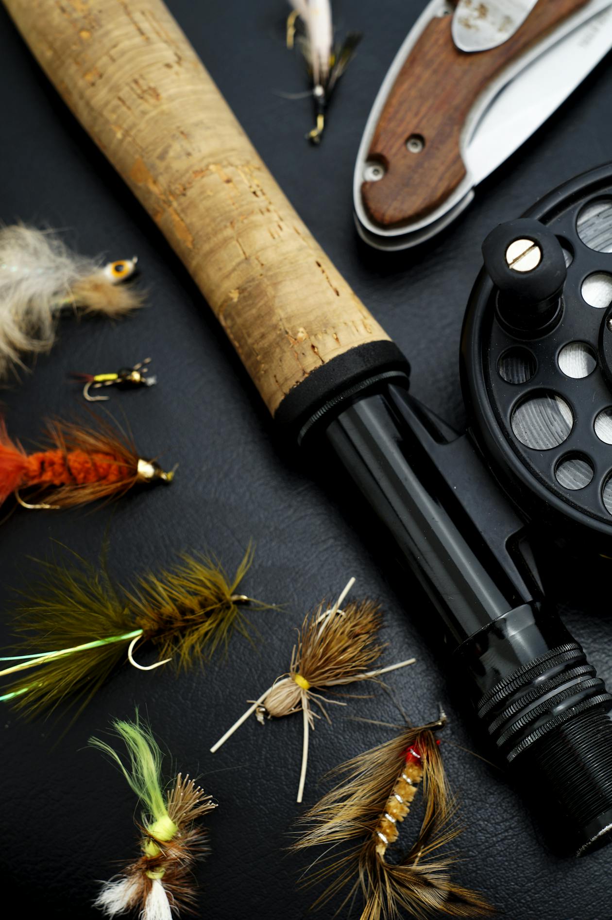 Fly fishing gear and colorful flies