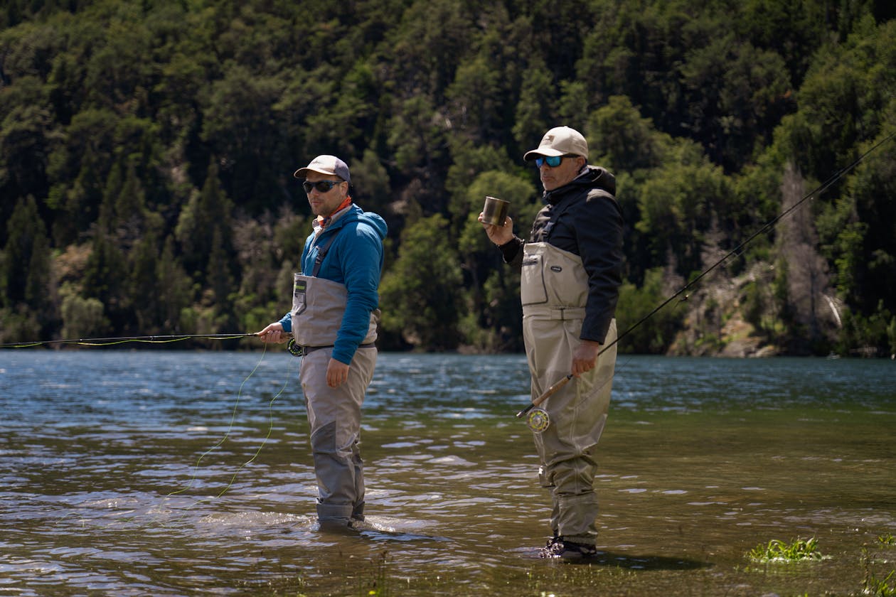 Two fly fishers in scenic river during guided float trip