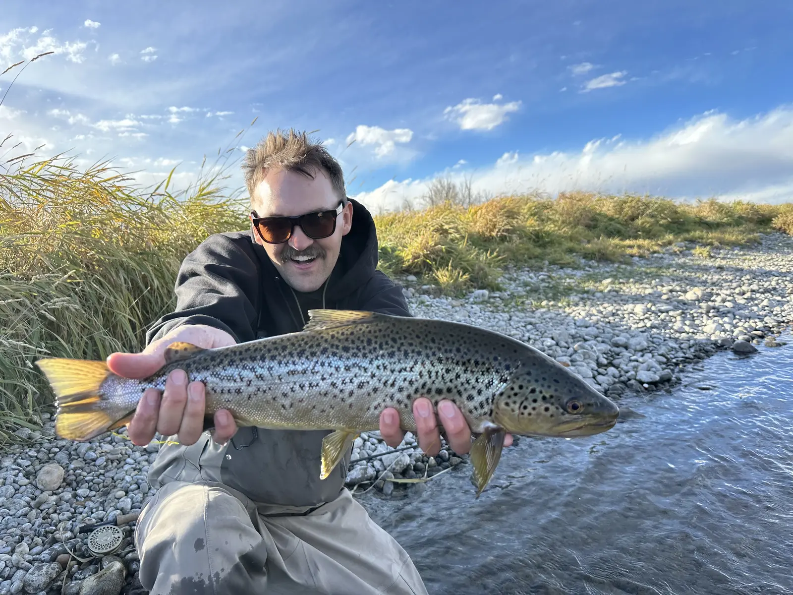 Dan holding a trophy trout on the Bow River