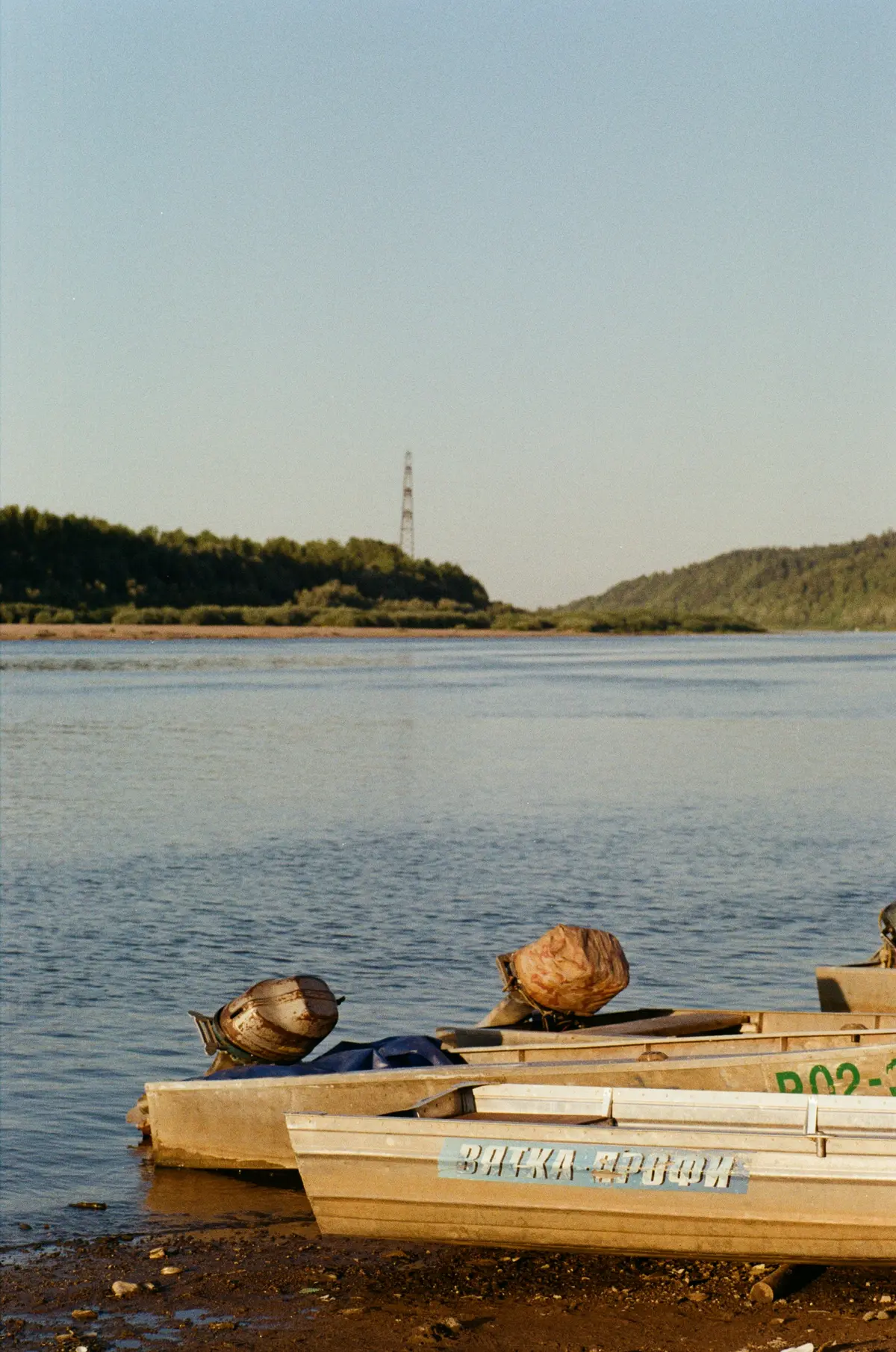 Drift boat on the shore of the Bow River ready for a guided fishing trip