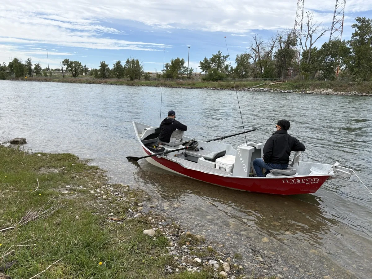 FlyPod drift boat on the shore of the Bow River ready for a fly fishing float trip
